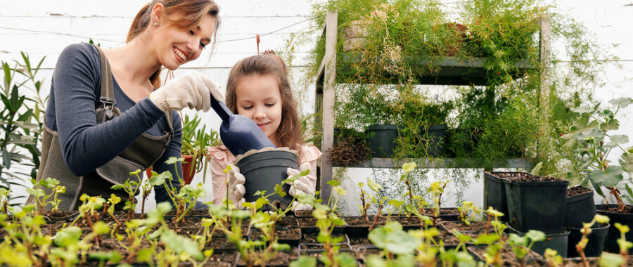 Mother and daughter gardening together after mother beats her stress and immune system
