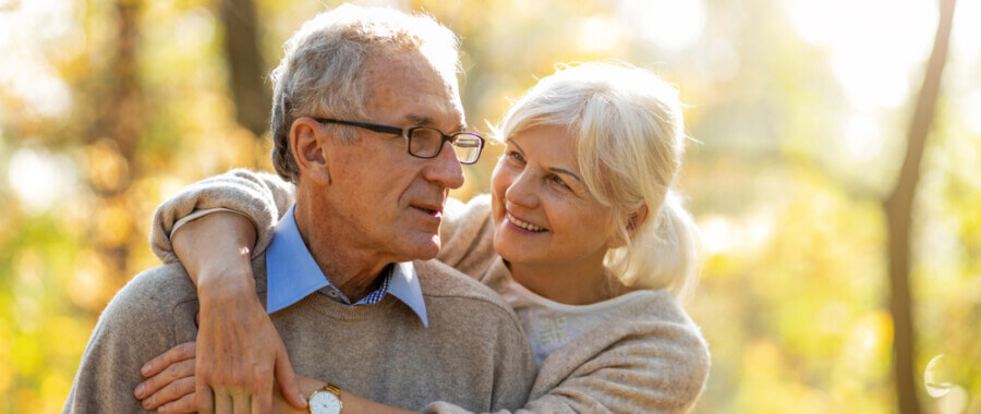 Senior couple outdoors who have found some relief by treating MS with functional medicine