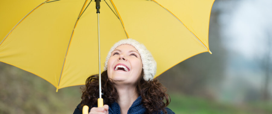 woman standing under umbrella